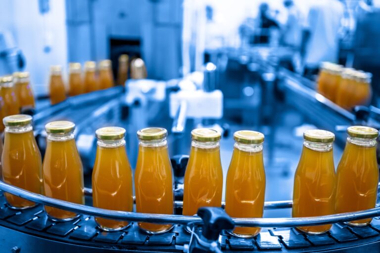 close up of bottle factory- bottles on conveyor